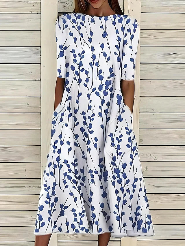 Nanna I Midikjole med kystblomsterprint