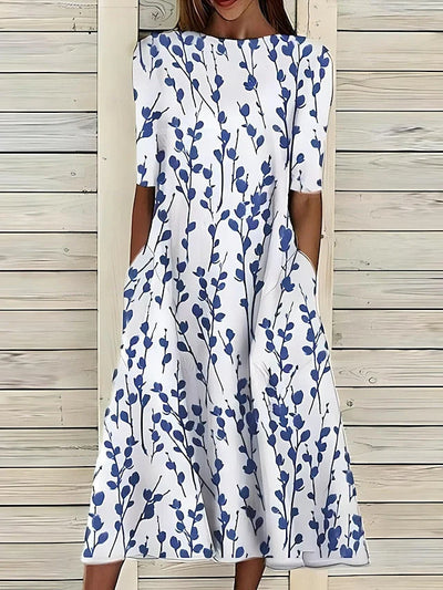 Nanna I Midikjole med kystblomsterprint